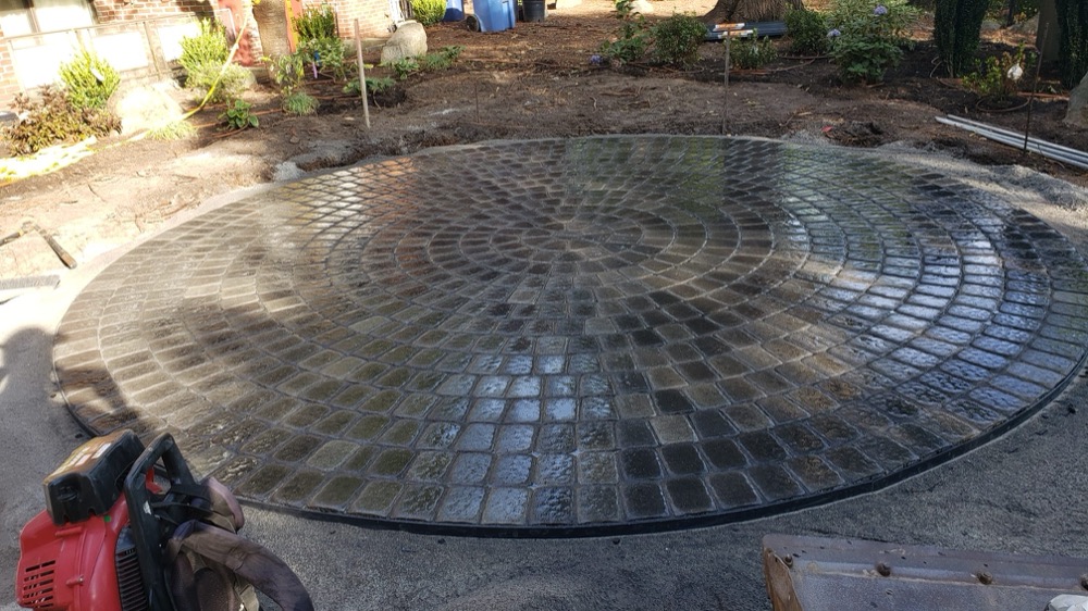 Circular paver patio, freshly sealed